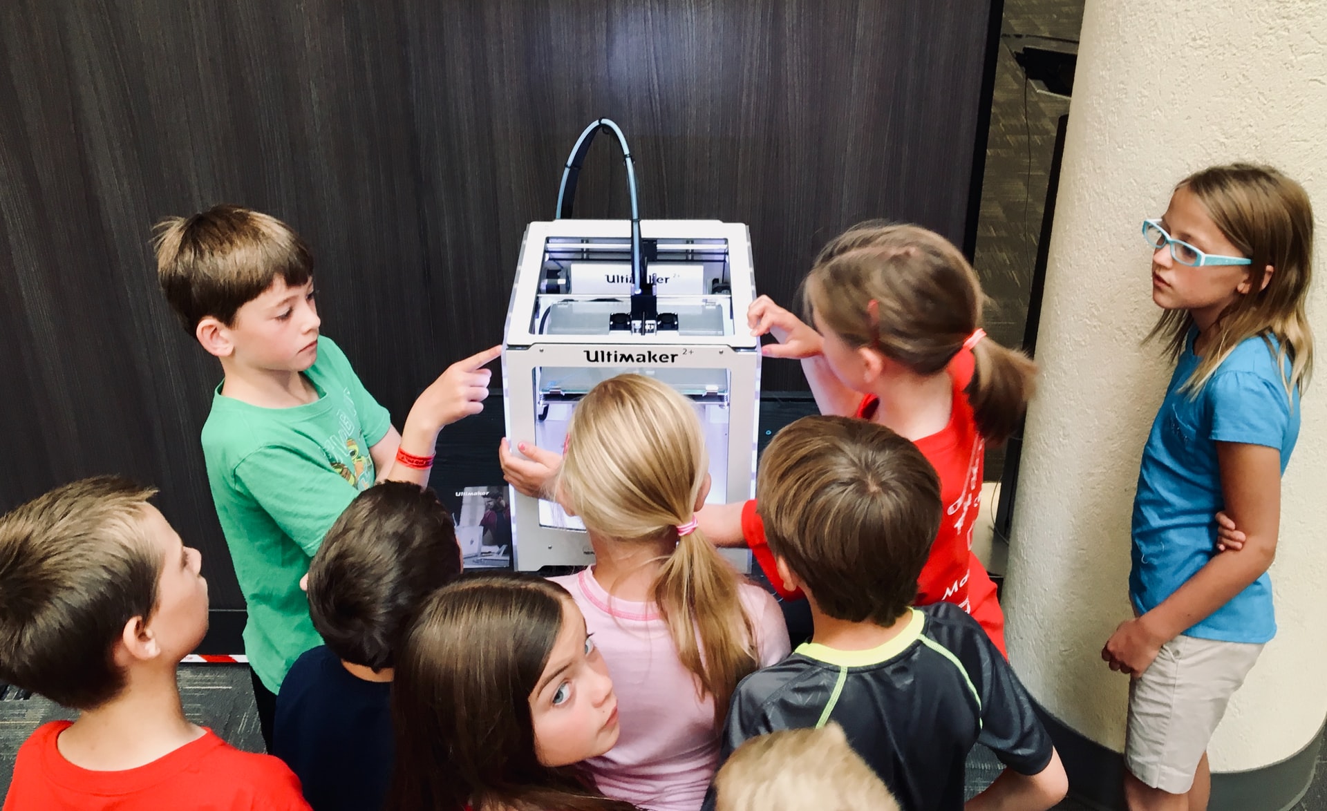 children and a 3D printer